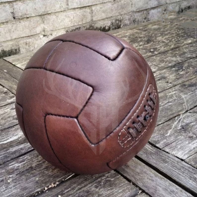 vintage leather soccer ball, 1930 World Cup football, handmade leather football, T-panel style soccer ball, antique football, retro soccer ball, collectible soccer ball, leather football gift, classic soccer ball, historic football replica, genuine leather football, World Cup memorabilia, soccer gift for him, football history gift, handcrafted soccer ball, vintage sports gear, customizable soccer ball, display soccer ball, football collector’s item, handmade vintage sports ball