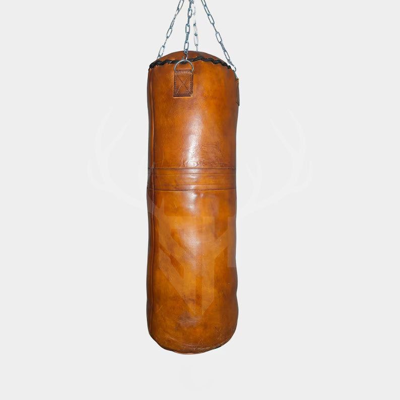 Vintage Titan Tan Leather Punching Bag displayed against a clean white background, showcasing its classic vintage tan color, full-grain cowhide leather, and traditional punching bag design ideal for boxing and MMA training.