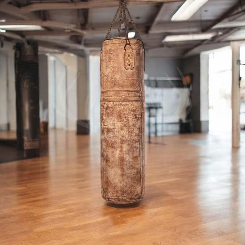 Detailed close-up of the Gravestone Heritage Leather Punching Bag showing the rich, rugged texture of full-grain cowhide leather. The hand-stitched seams and natural leather grain highlight the bag’s premium craftsmanship, durability, and authentic vintage look—perfect for boxing, MMA, and fitness enthusiasts seeking high-quality training equipment.
