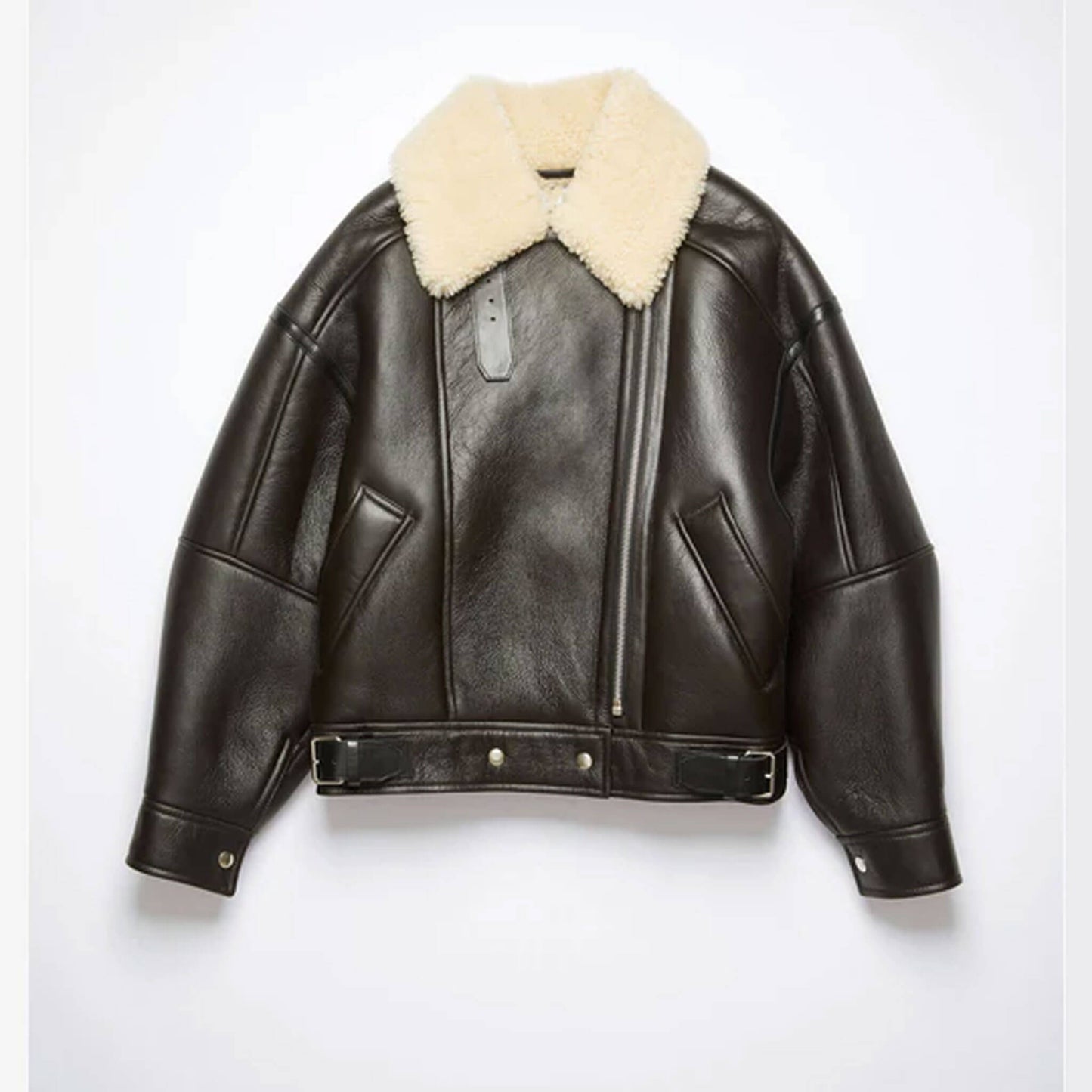 Front view of a women’s black shearling aviator jacket made from genuine cowhide leather with a soft faux shearling lining and oversized beige shearling collar. Features include zip closure, belted waist, and side pockets, styled on a female model to highlight its premium winter fashion look, blending cozy warmth with timeless streetwear style.
