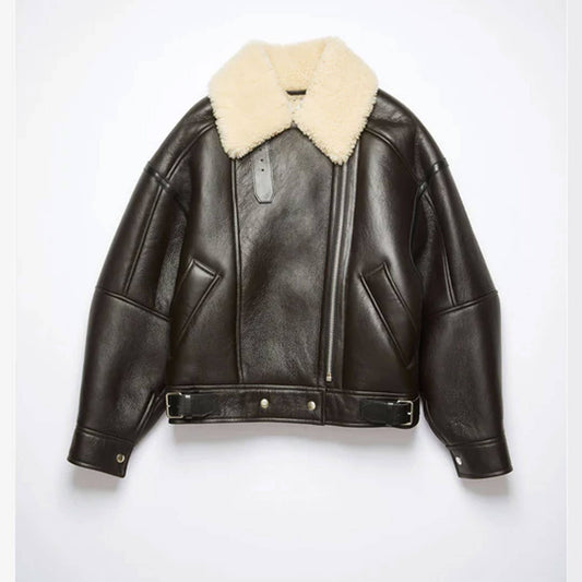 Front view of a women’s black shearling aviator jacket made from genuine cowhide leather with a soft faux shearling lining and oversized beige shearling collar. Features include zip closure, belted waist, and side pockets, styled on a female model to highlight its premium winter fashion look, blending cozy warmth with timeless streetwear style.