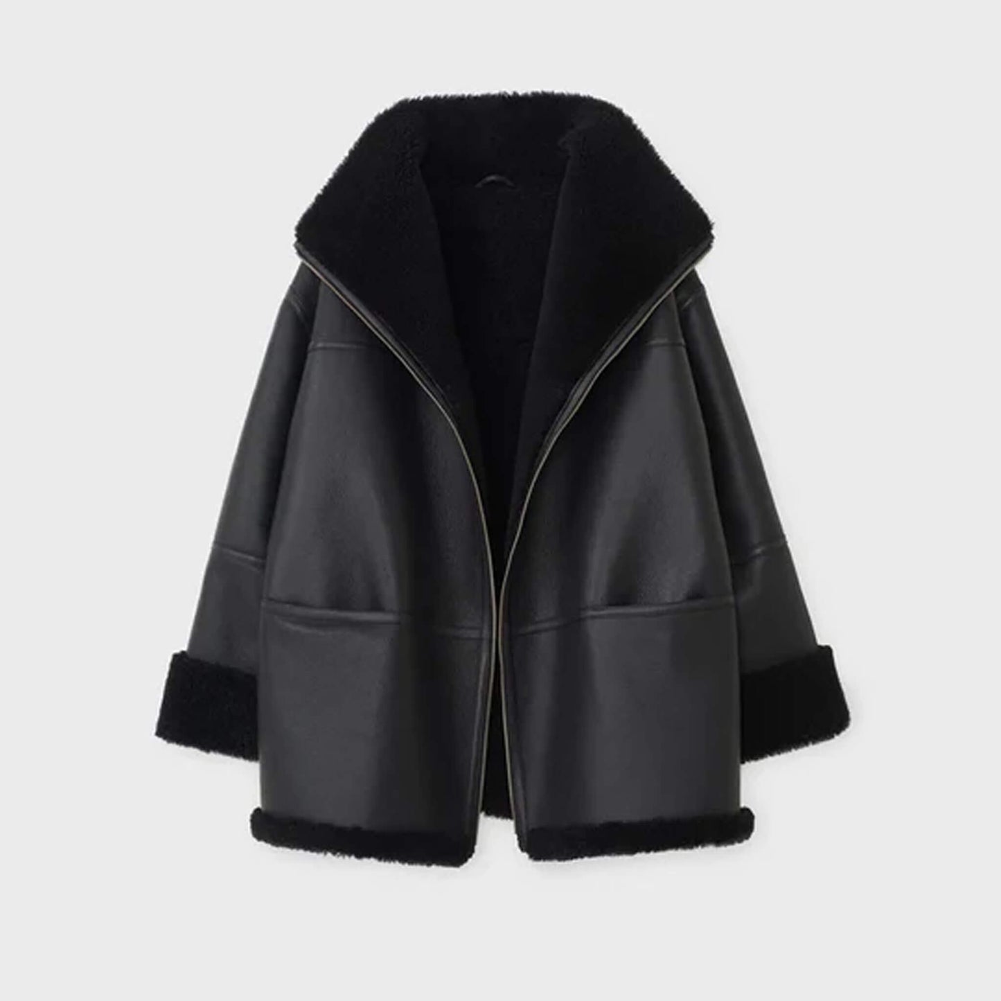 Detailed texture view of goatskin leather with faux fur lining on the Midnight Luxe Shearling Jacket, highlighting premium craftsmanship, oversized relaxed silhouette, folded cuffs, and luxury winterwear design.