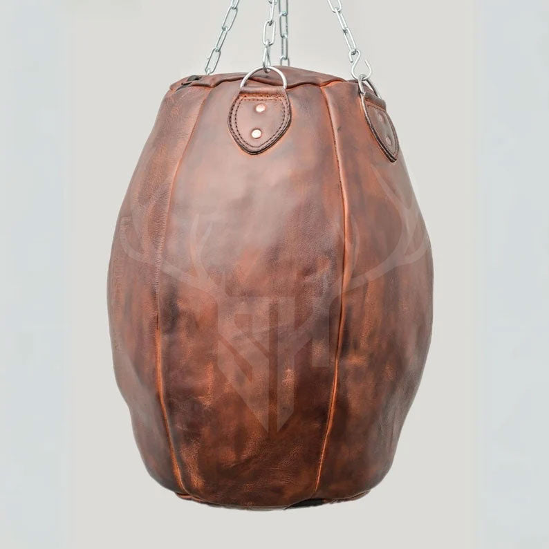 Zoomed-in view of the leather texture on the Brutestone Bag, revealing hand-stitched seams and natural cowhide grain. Highlights vintage design, artisanal craftsmanship, and strong leather built to last under intense boxing or martial arts use. Ideal for fitness brands and authentic fight gear promotions.
