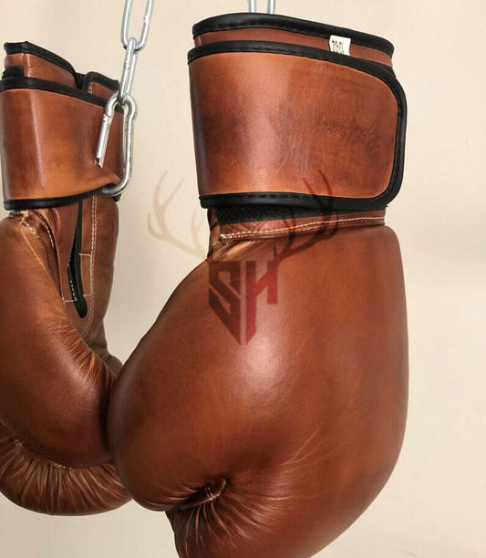 Durable training gloves made of thick cowhide leather, built for long-term boxing and Muay Thai sessions.