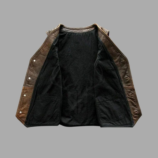 Premium distressed leather vest for bikers, featuring breathable lining, brass buttons, and spacious pockets for secure storage on long motorcycle journeys.
