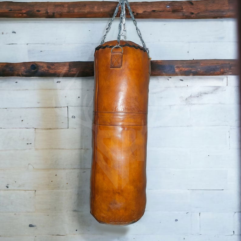Size chart for the Vintage Titan Tan Leather Punching Bag featuring 3ft, 4ft, 5ft, and 6ft options with approximate filled weights, helping customers choose the perfect heavy bag for their training needs.