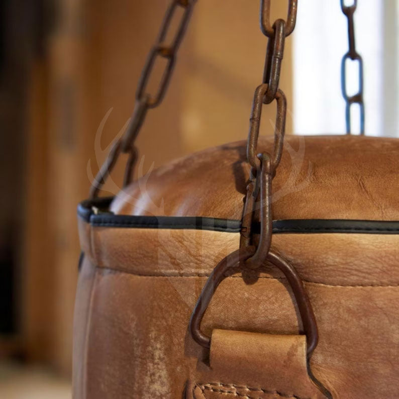 A detailed close-up of the cowhide leather surface and classic retro lacing on the Gravestone Heritage Punching Bag. Perfect for showcasing the quality craftsmanship, rugged hand-stitched seams, and raw, vintage aesthetics built for professional training and long-lasting use.