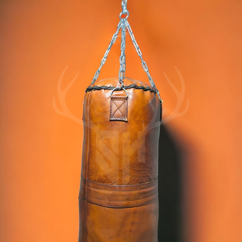 Close-up view of premium reinforced hand-stitching on the Vintage Titan Tan Leather Punching Bag, showing durable craftsmanship and heavy-duty cowhide leather perfect for long-lasting use in boxing and MMA training.