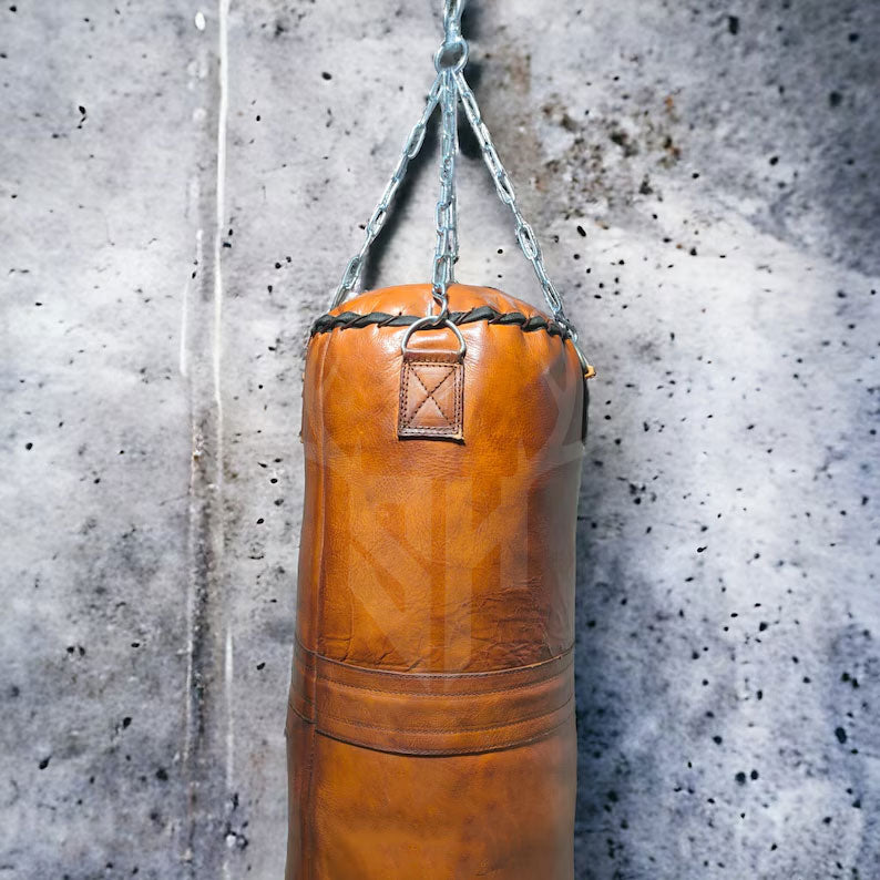 High-quality stainless steel hanging chain and secure fasteners on the Vintage Titan Tan Leather Punching Bag, designed to provide safe, professional-grade suspension for intense boxing and martial arts workouts.