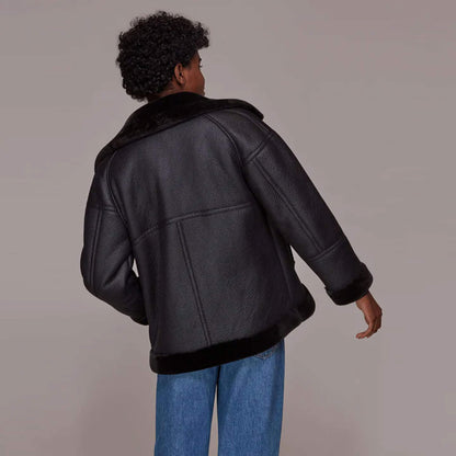 Back view of Ebon Shearling Black Leather Jacket featuring matte black finish, premium craftsmanship, and fur-lined structure offering elegance, durability, and warmth for winter wear.