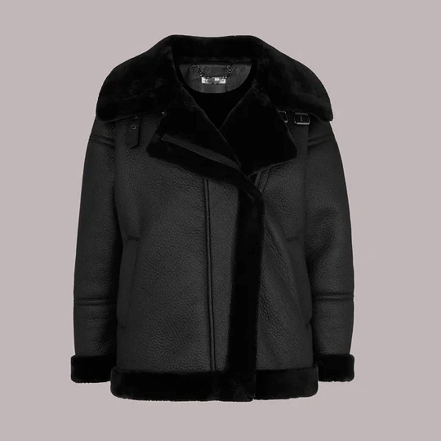Front view of the Ebon Shearling Black Leather Jacket made from premium leather with full shearling lining, showcasing oversized fur collar, matte black finish, and winter-ready design perfect for luxury outerwear fashion.