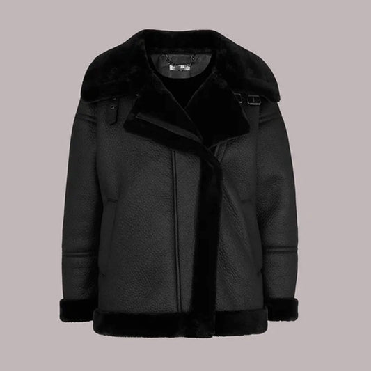 Front view of the Ebon Shearling Black Leather Jacket made from premium leather with full shearling lining, showcasing oversized fur collar, matte black finish, and winter-ready design perfect for luxury outerwear fashion.
