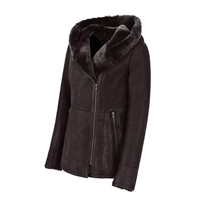 Luxury women’s shearling leather jacket in black with fur-trimmed hood, designed for winter elegance and warmth. Made from premium genuine leather with soft shearling lining, this hooded coat offers a perfect balance of comfort and sophistication. With its fitted cut, zip closure, and stylish detailing, this chic winter leather jacket is ideal for ladies seeking timeless outerwear with a fashionable touch.