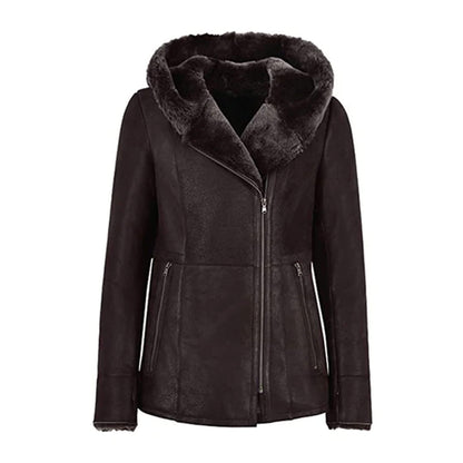 Women’s black shearling leather jacket with fur hood, crafted from genuine leather and lined with plush shearling for maximum warmth. Featuring a modern asymmetrical zip closure, tailored fit, and zippered pockets, this luxury winter jacket blends style, comfort, and durability. Perfect for chic winter outfits, outdoor wear, or elegant cold-weather fashion, this hooded leather coat keeps you cozy and stylish all season.
