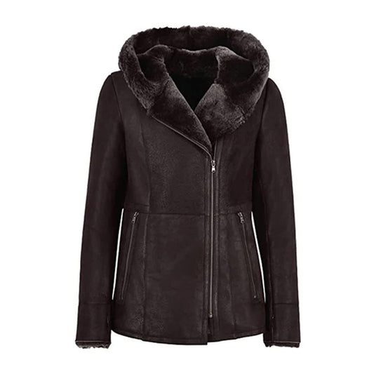 Women’s black shearling leather jacket with fur hood, crafted from genuine leather and lined with plush shearling for maximum warmth. Featuring a modern asymmetrical zip closure, tailored fit, and zippered pockets, this luxury winter jacket blends style, comfort, and durability. Perfect for chic winter outfits, outdoor wear, or elegant cold-weather fashion, this hooded leather coat keeps you cozy and stylish all season.
