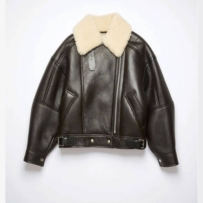 Front view of a women’s black shearling aviator jacket made from genuine cowhide leather with a soft faux shearling lining and oversized beige shearling collar. Features include zip closure, belted waist, and side pockets, styled on a female model to highlight its premium winter fashion look, blending cozy warmth with timeless streetwear style.