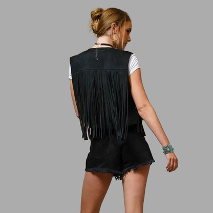 Back view of the women’s Onyx Black fringe vest, with long fringes flowing along the hem and sides, perfect for boho and biker styling alike.

