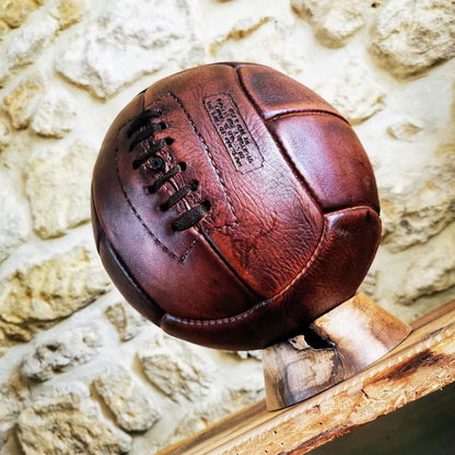 Classic throwback leather football, crafted with authentic detail and rich patina, ideal for collectors and nostalgic sports enthusiasts.