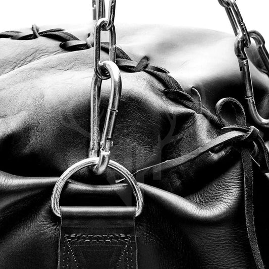 Close-up of the Black Buffalo Striker Heavy Punching Bag showing its premium 100% genuine cowhide leather surface, detailed reinforced hand-stitching, and rugged texture. This durable leather punching bag is designed for professional boxing, MMA, and Muay Thai training, offering superior wear resistance and longevity. Perfect for high-intensity combat sports workouts.

