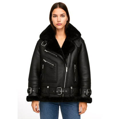 Front view of the Veloria Black Shearling Biker Jacket for women, crafted from goatskin leather with faux shearling lining. Features an oversized shearling collar, asymmetrical zip closure, belted waist and cuffs, and multiple zippered pockets. A bold biker-inspired silhouette designed for stylish winter outerwear with durability, comfort, and timeless edgy appeal.