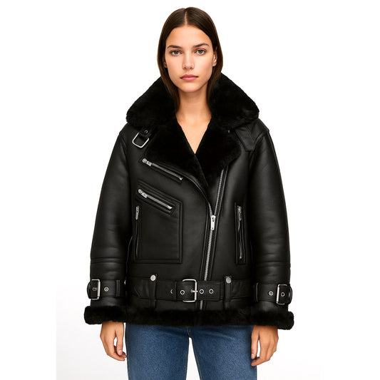 Front view of the Veloria Black Shearling Biker Jacket for women, crafted from goatskin leather with faux shearling lining. Features an oversized shearling collar, asymmetrical zip closure, belted waist and cuffs, and multiple zippered pockets. A bold biker-inspired silhouette designed for stylish winter outerwear with durability, comfort, and timeless edgy appeal.