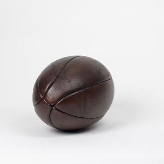 Full-grain leather heritage rugby ball inspired by early American football, customizable for gifting or display.

