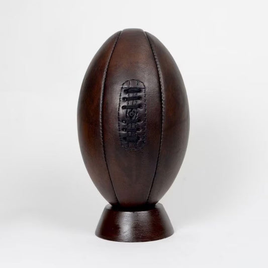 Handcrafted vintage 1900s-style leather rugby ball with lace-up front, ideal for collectors and retro sports-themed decor.
