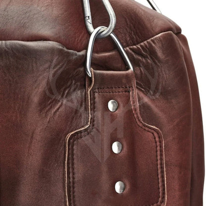Close-up image focusing on the stainless steel hanging chains and fasteners of the Ironclad Titan Uppercut Boxing Bag. These heavy-duty chains guarantee secure suspension, suitable for professional and home gym use.

