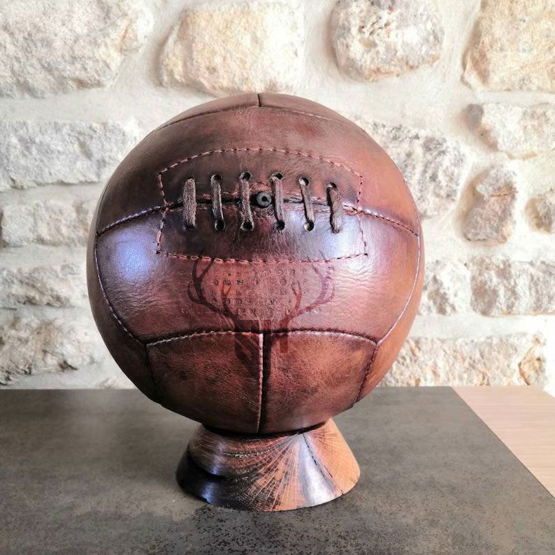Personalized vintage football with engraved initials or logo, made from durable vegetable-tanned leather in old-school NFL style.

