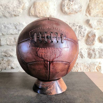 Personalized vintage football with engraved initials or logo, made from durable vegetable-tanned leather in old-school NFL style.


