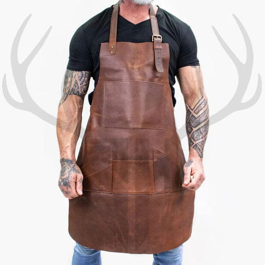ForgeWear Rustic Leather Work Apron in distressed brown full-grain leather displayed flat, showcasing its large and small pockets, adjustable neck and waist straps, and antique brass hardware—ideal for woodworking, barbers, blacksmiths, and craftspeople.


