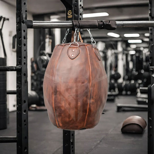 Front view of the Brutestone Leather Wrecking Ball Bag highlighting its vintage full-grain cowhide leather, classic laced top, and professional-grade build. Designed for boxing, MMA, and Muay Thai workouts, this compact heavy bag delivers superior resistance, realism, and handcrafted style for home gyms and elite training facilities.

