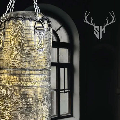 Weight specifications of Golden Croc Leather Heavy Punching Bag for different sizes: 3ft (25kg), 4ft (32kg), 5ft (42kg), and 6ft (52kg). Unfilled bag for custom weight filling.