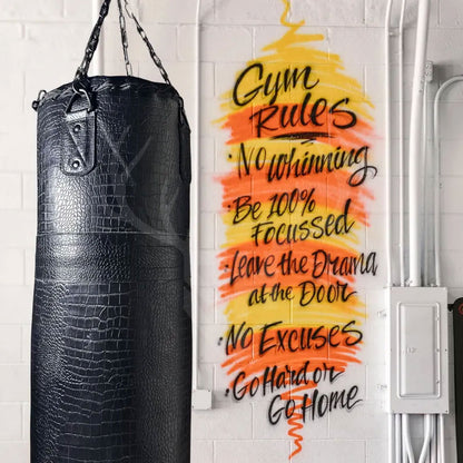 Top view of the Onyx Croc Punching Bag showing the leather lace closure system for easy filling access, secured with durable grommets and reinforced leather flaps.

