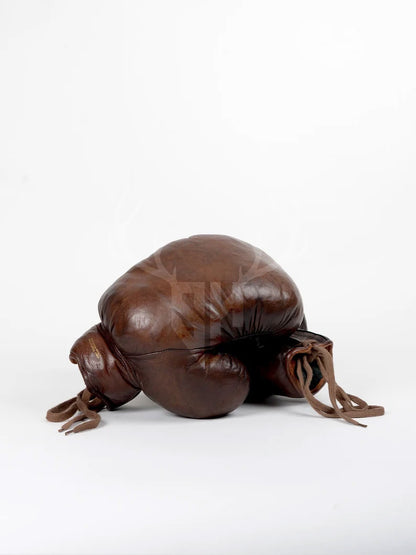 Side angle of Staghide Retro Vintage Brown Leather Boxing Gloves showcasing handcrafted design, natural fiber padding, and classic lacing system for superior fit and comfort.