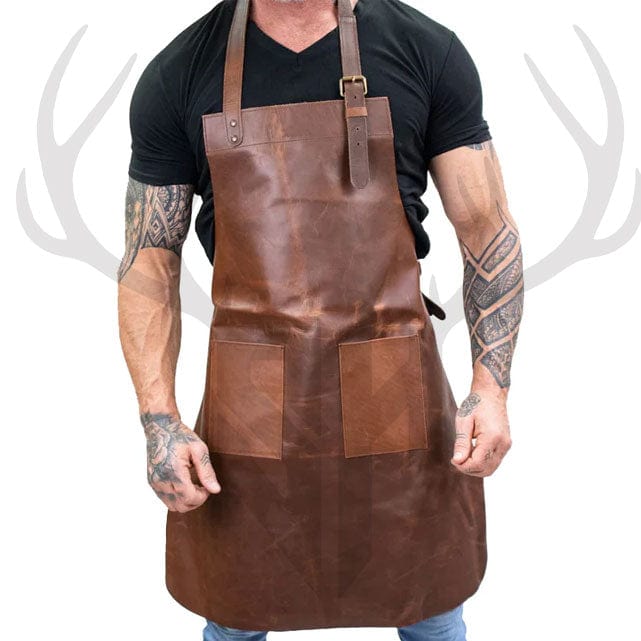 Front view of the Stonewood Artisan Leather Apron in rustic brown full-grain leather, displayed with dual large pockets, adjustable neck and waist straps, and vintage brass fittings—perfect for chefs, woodworkers, and crafters looking for durable, stylish protection.


